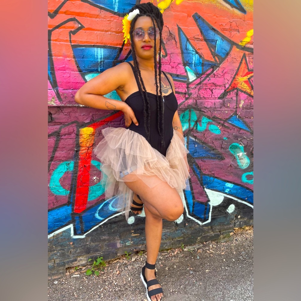 Akira black bodysuit with tulle leg trimming. Size Large.